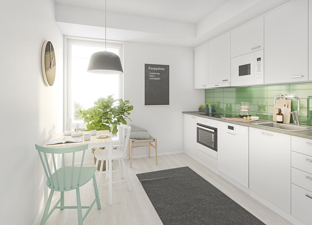 Vaaleasävyinen kodikas keittiö, jossa on tiski- ja työtason päällä seinässä vaaleanvihreät laatat. 